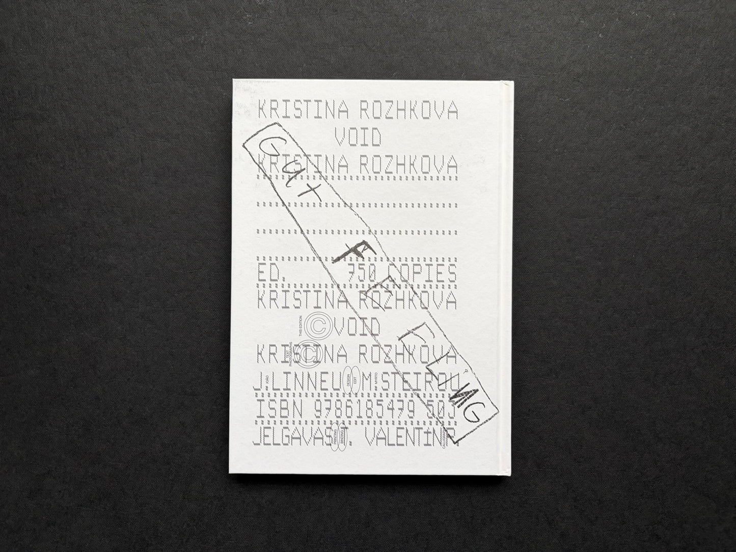 Gut Feeling by Kristina Rozhkova, back cover on a dark fabric background