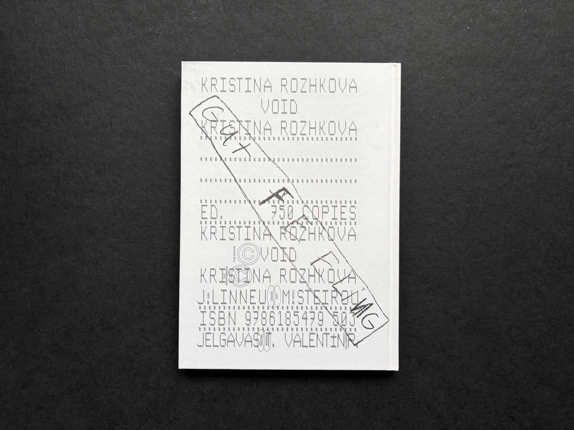 Gut Feeling by Kristina Rozhkova, back cover on a dark fabric background