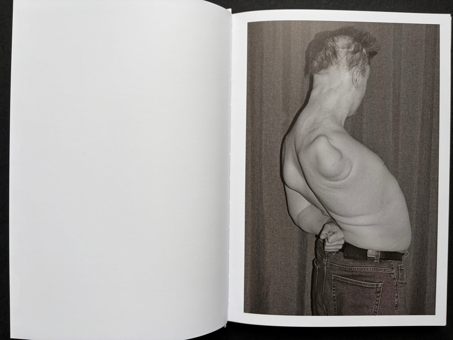 Gut Feeling by Kristina Rozhkova, open spread with a blank left page and a black-and-white portrait on the right