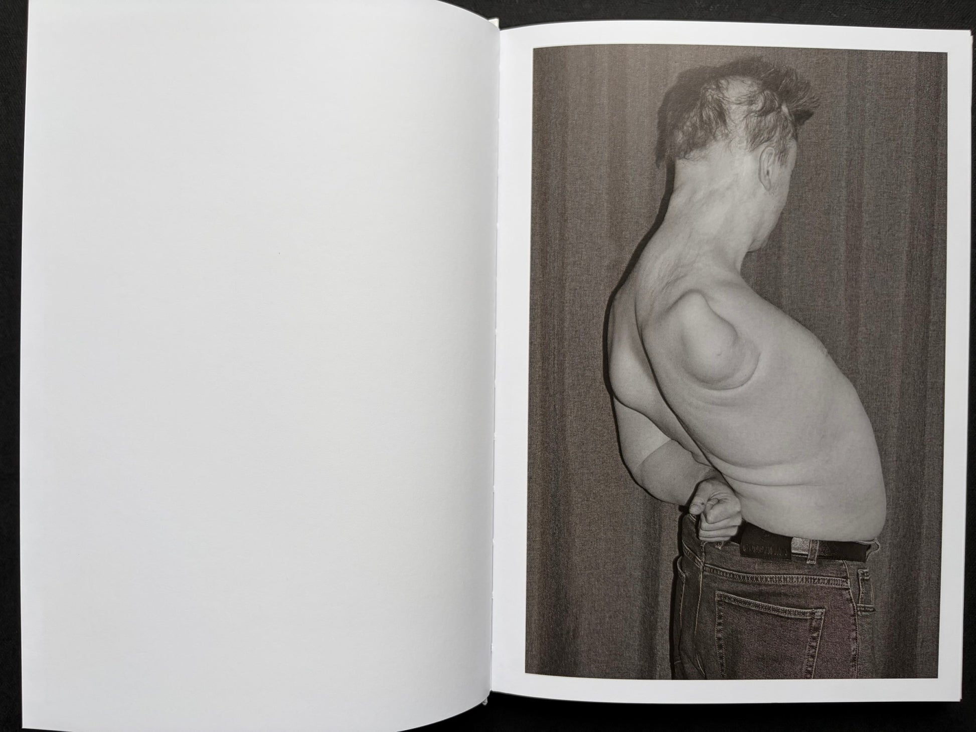 Gut Feeling by Kristina Rozhkova, open spread with a blank left page and a black-and-white portrait on the right