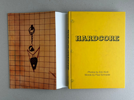 HARDCORE by Eric Kroll, shown with the yellow hardcover and illustrated dust jacket laid open beside it.