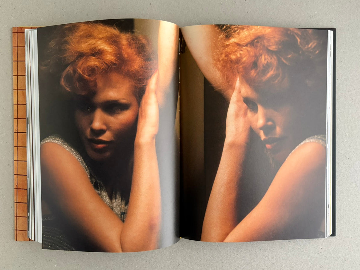 Open spread from HARDCORE by Eric Kroll, showing two full-page portraits of a woman with red hair and raised arms.
