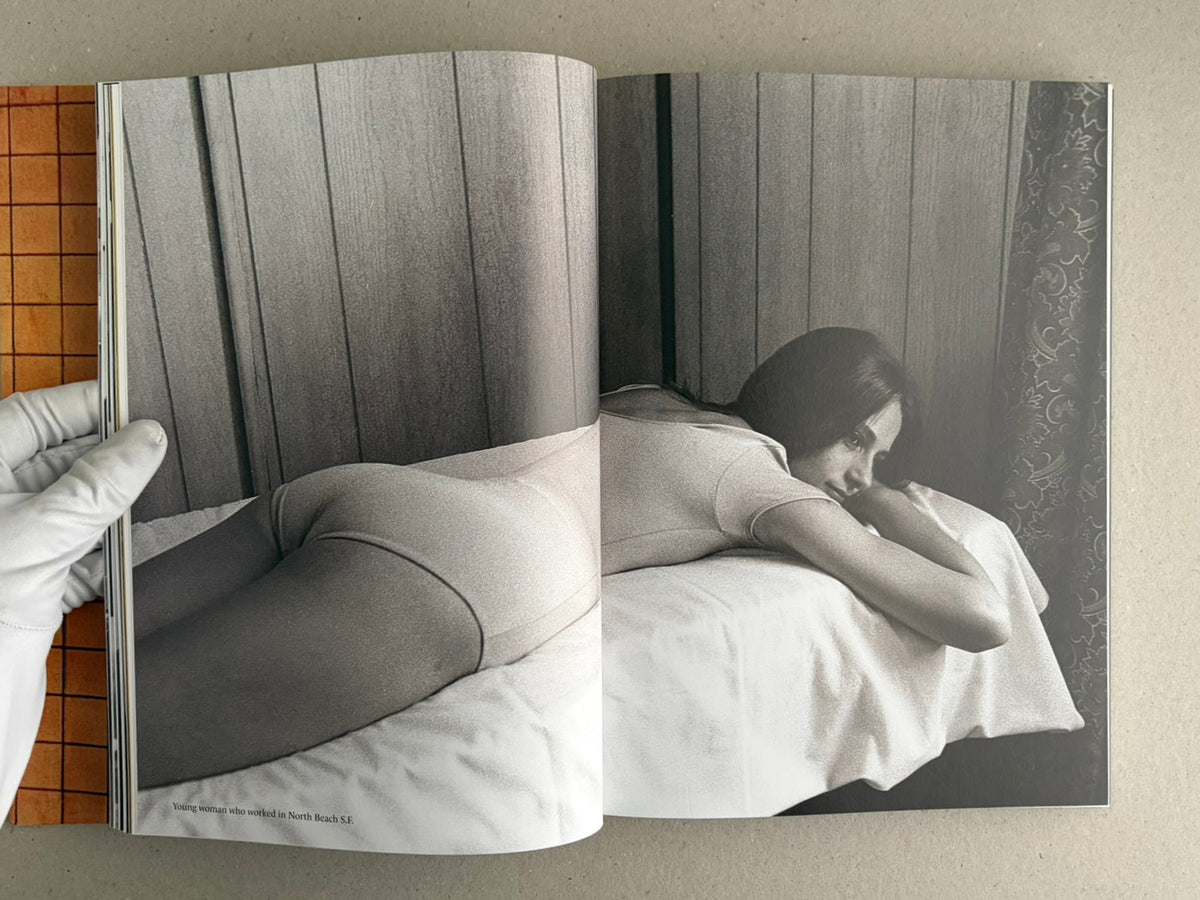 Open spread from HARDCORE by Eric Kroll, showing a black-and-white photograph of a woman lying on a bed.