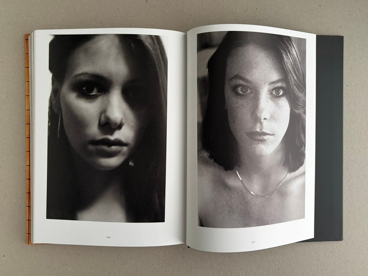 Open spread of HARDCORE (Dust Jacket) – Eric Kroll, showing two black-and-white portrait photographs on pages 216 and 217.