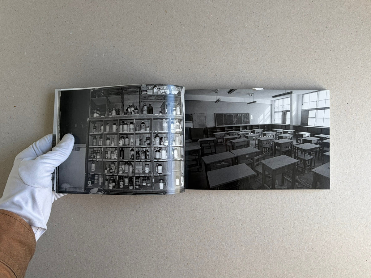 Open spread of Hashima by Taiji Matsue, showing black-and-white interior photographs.