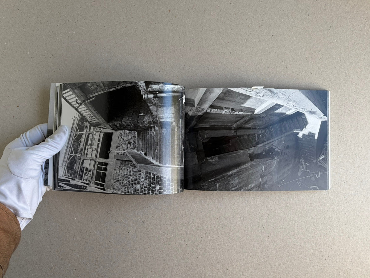 Open spread of Hashima - Taiji Matsue showing black-and-white photographs of abandoned industrial structures.