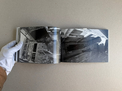 Open spread of Hashima - Taiji Matsue showing black-and-white photographs of abandoned industrial structures.