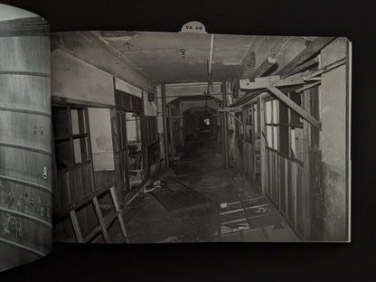 Dark corridor of abandoned buildings photographed on Hashima Island