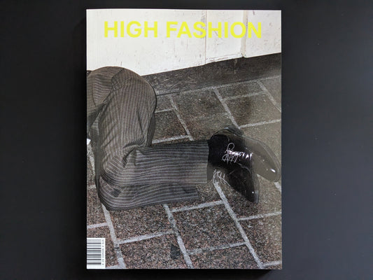 Front cover of "High Fashion" by Pawel Jaszczuk, with yellow title text and man's legs