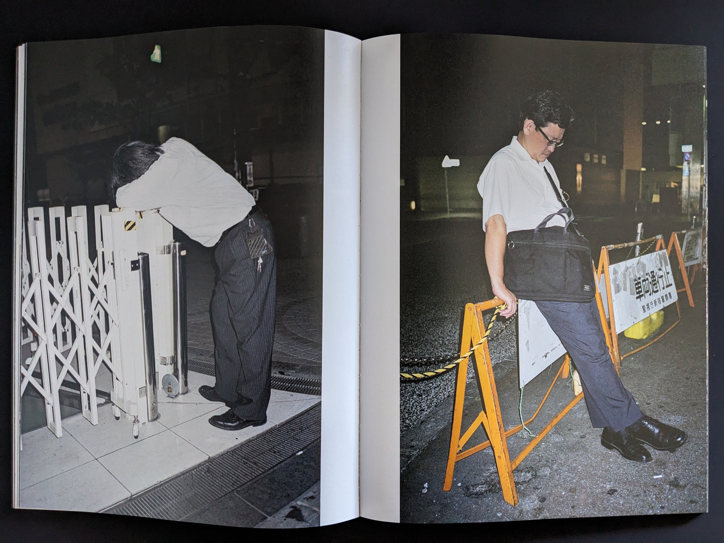 Open spread of men in office wear collapsed on pavement at night
