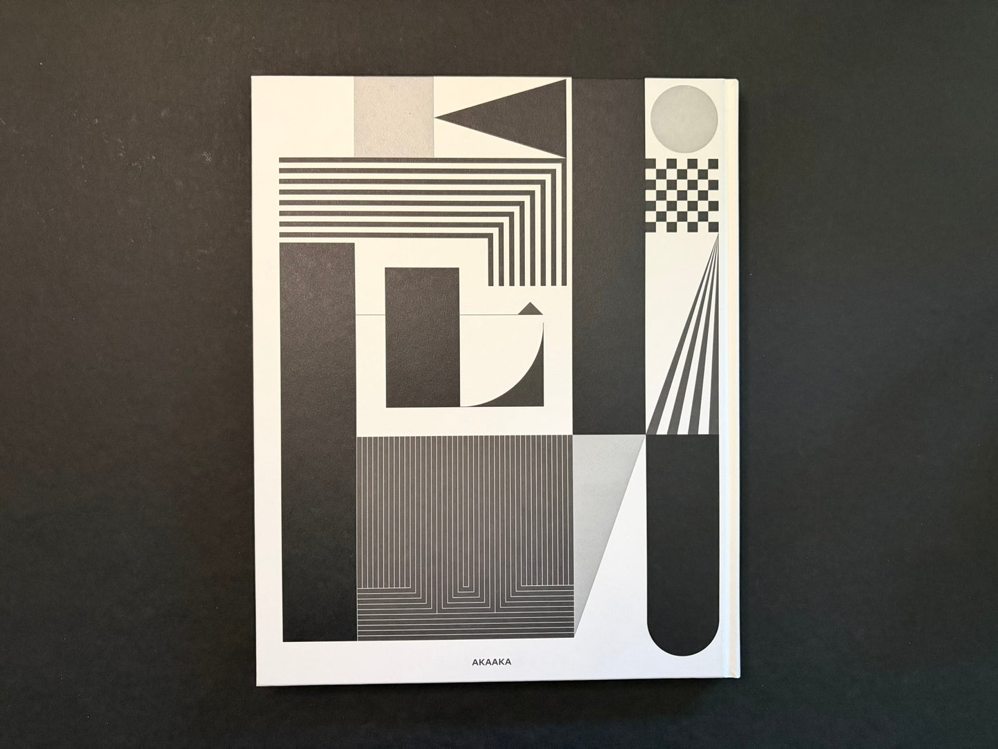 Back cover of Homo Ludens by Masahisa Fukase with the same geometric black, white, and grey design