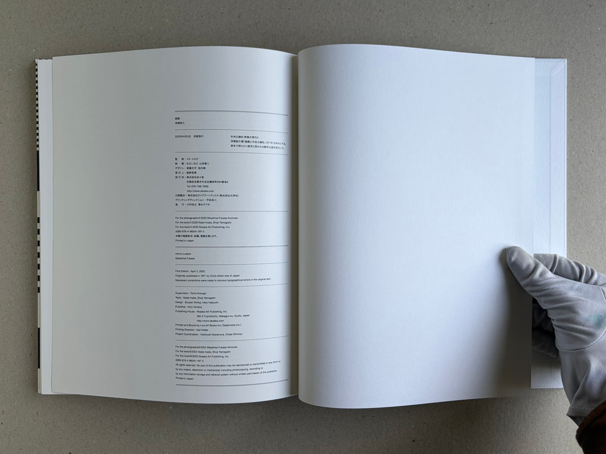Homo Ludens open to the colophon and a blank facing page