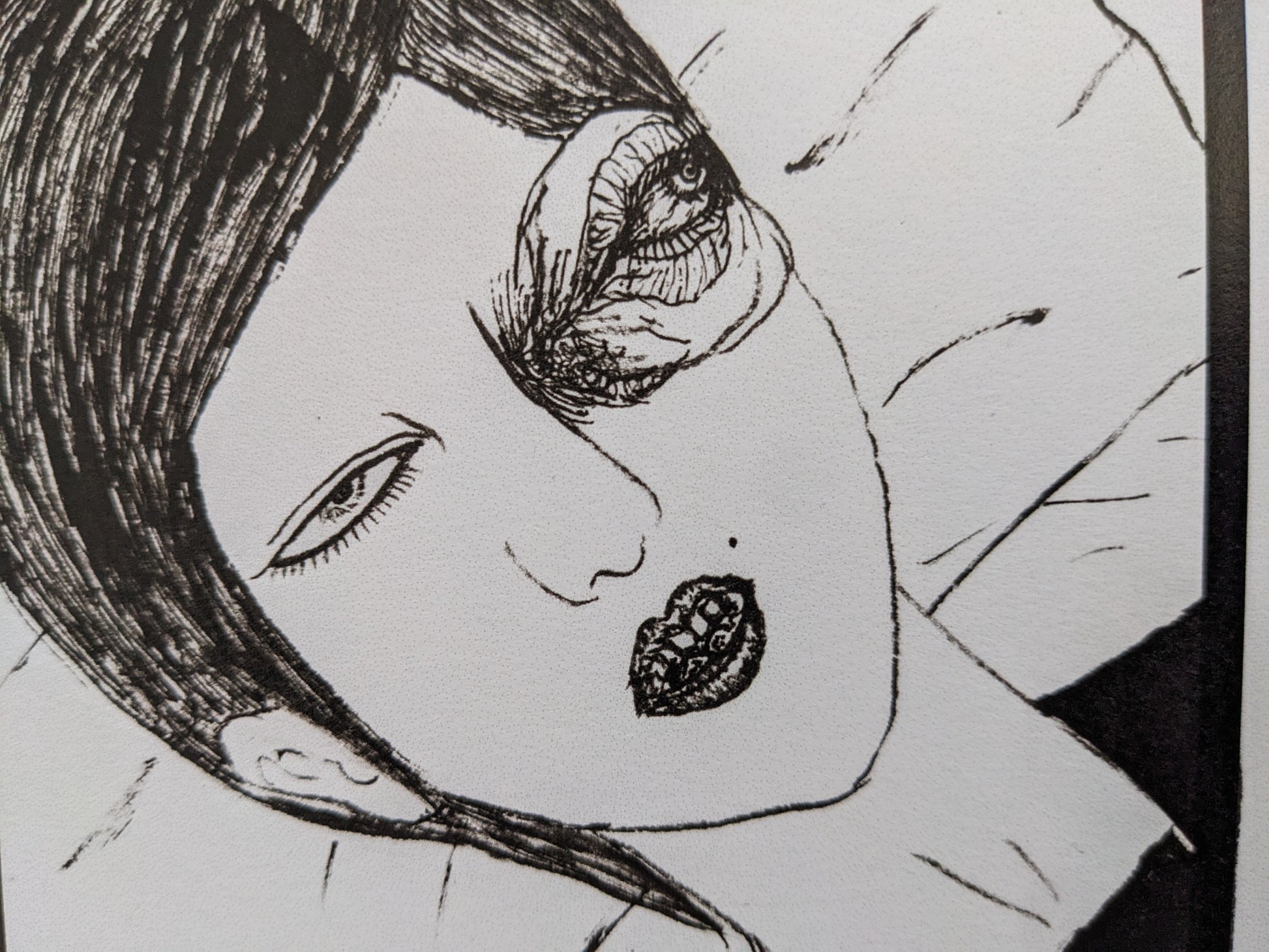 Close-up from 'Hospital Train' by Daisuke Ichiba with a surreal eye emerging from a woman's face.