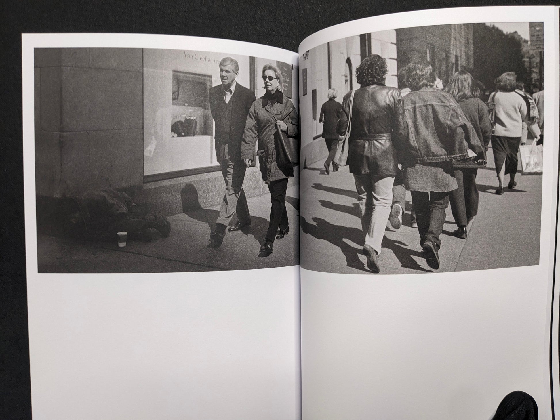 Interior spread from Hotshoe Issue 214 with black-and-white street photographs of pedestrians, including figures walking away along a sidewalk.