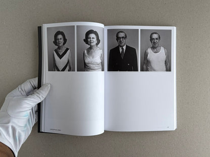 Open spread of Hotshoe Issue 214: Stephen Shore showing four black-and-white portrait photographs on the page, held open by a gloved hand.