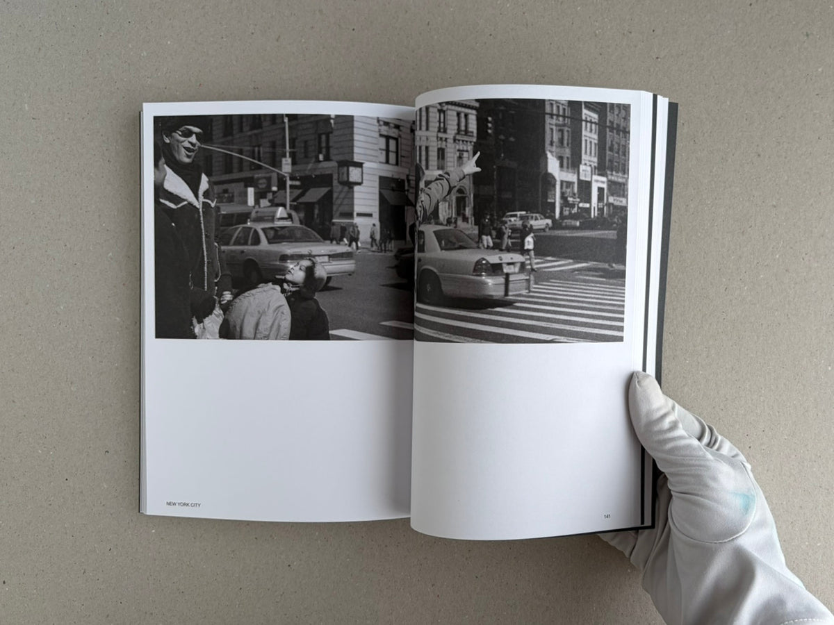 Open spread of Hotshoe Issue 214: Stephen Shore showing two black-and-white street photographs, held open by a gloved hand.