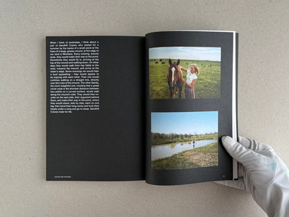 Open Hotshoe Issue 214: Stephen Shore showing a text page on the left and two colour photographs on the right, held open by a gloved hand.