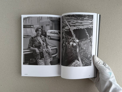 Hotshoe Issue 214: Stephen Shore open to a spread with two black-and-white photographs, held by a gloved hand.