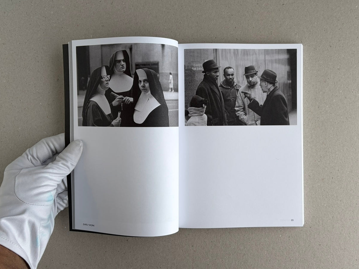 Open spread of Hotshoe Issue 214: Stephen Shore showing two black-and-white photographs on facing pages, with a gloved hand holding the book.