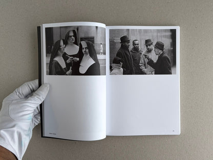 Open spread of Hotshoe Issue 214: Stephen Shore showing two black-and-white photographs on facing pages, with a gloved hand holding the book.