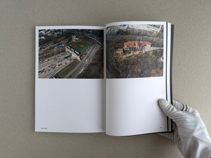 Open spread of Hotshoe Issue 214: Stephen Shore showing two colour photographs, with page number 167 visible and a gloved hand holding the book.