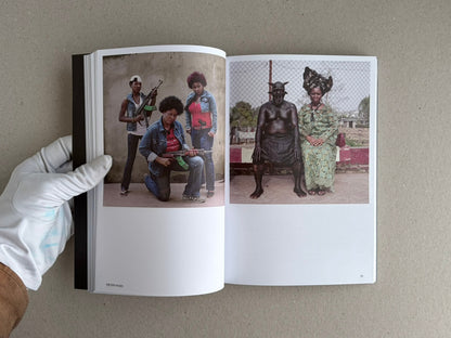 Open Hotshoe Issue 215: At the Movies showing a two-page spread with colour photographs of posed figures, including one spread with three people holding rifles and another with two seated figures.