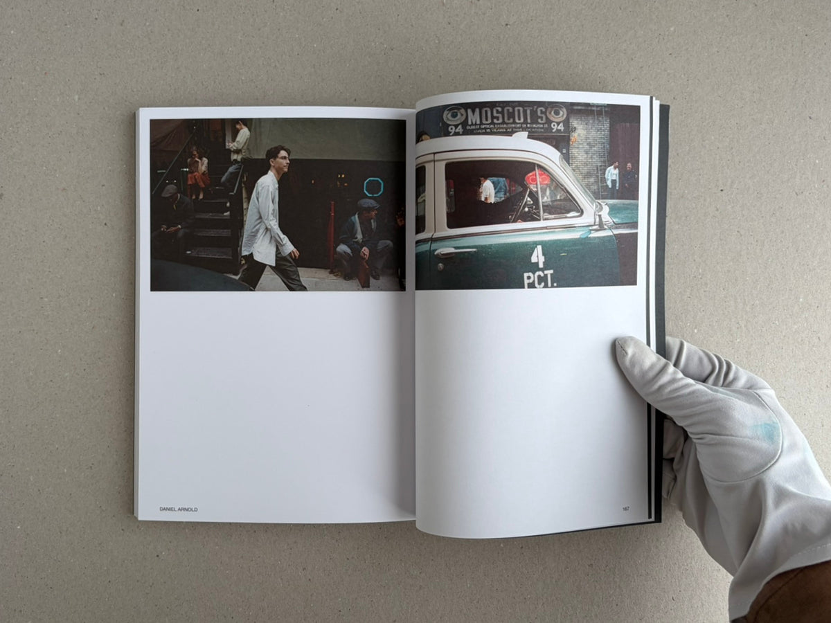 Open Hotshoe Issue 215: At the Movies showing a two-page spread with film set photographs and a gloved hand holding the magazine.