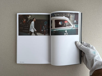 Open Hotshoe Issue 215: At the Movies showing a two-page spread with film set photographs and a gloved hand holding the magazine.