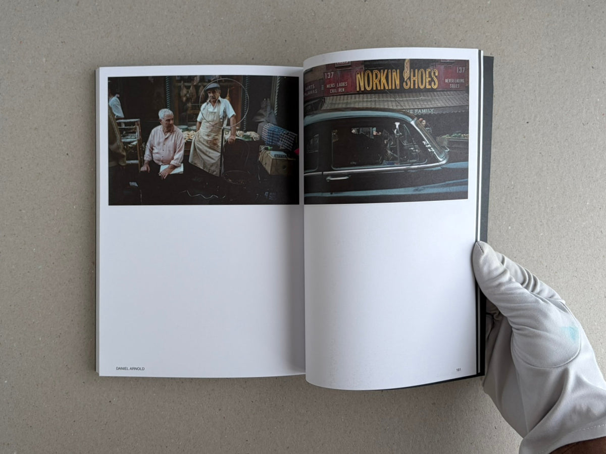 Open spread of Hotshoe Issue 215: At the Movies, showing two film-set photographs and a gloved hand holding the magazine.
