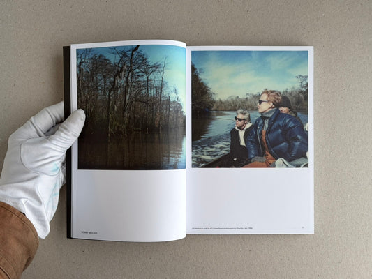 Open spread of Hotshoe Issue 215: At the Movies, showing a forest scene on the left page and three people in a boat on the right page.