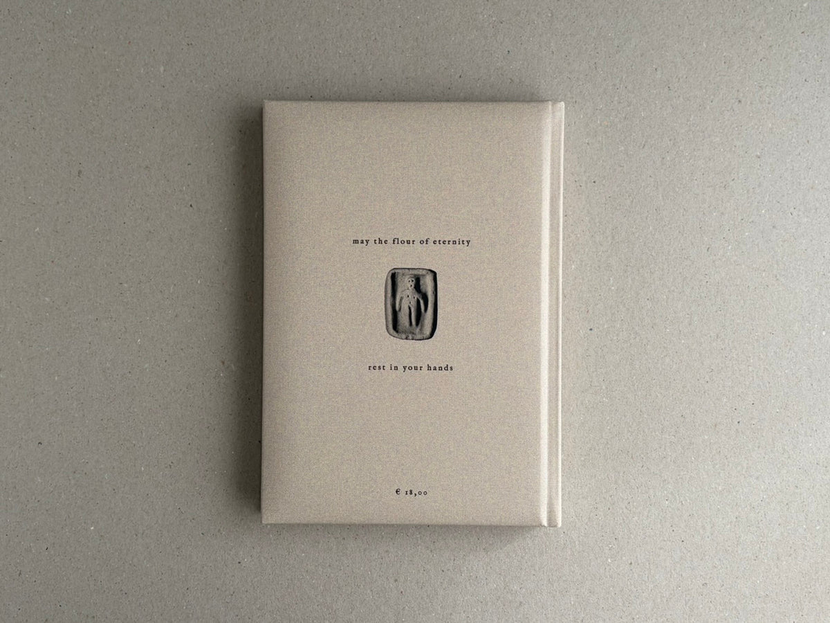 Front cover of How to Bake a Breadling – Brad Hock, showing a pale padded hardcover with centered text and a small relief-like figure on a plain grey surface.