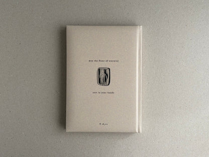 Front cover of How to Bake a Breadling – Brad Hock, showing a pale padded hardcover with centered text and a small relief-like figure on a plain grey surface.