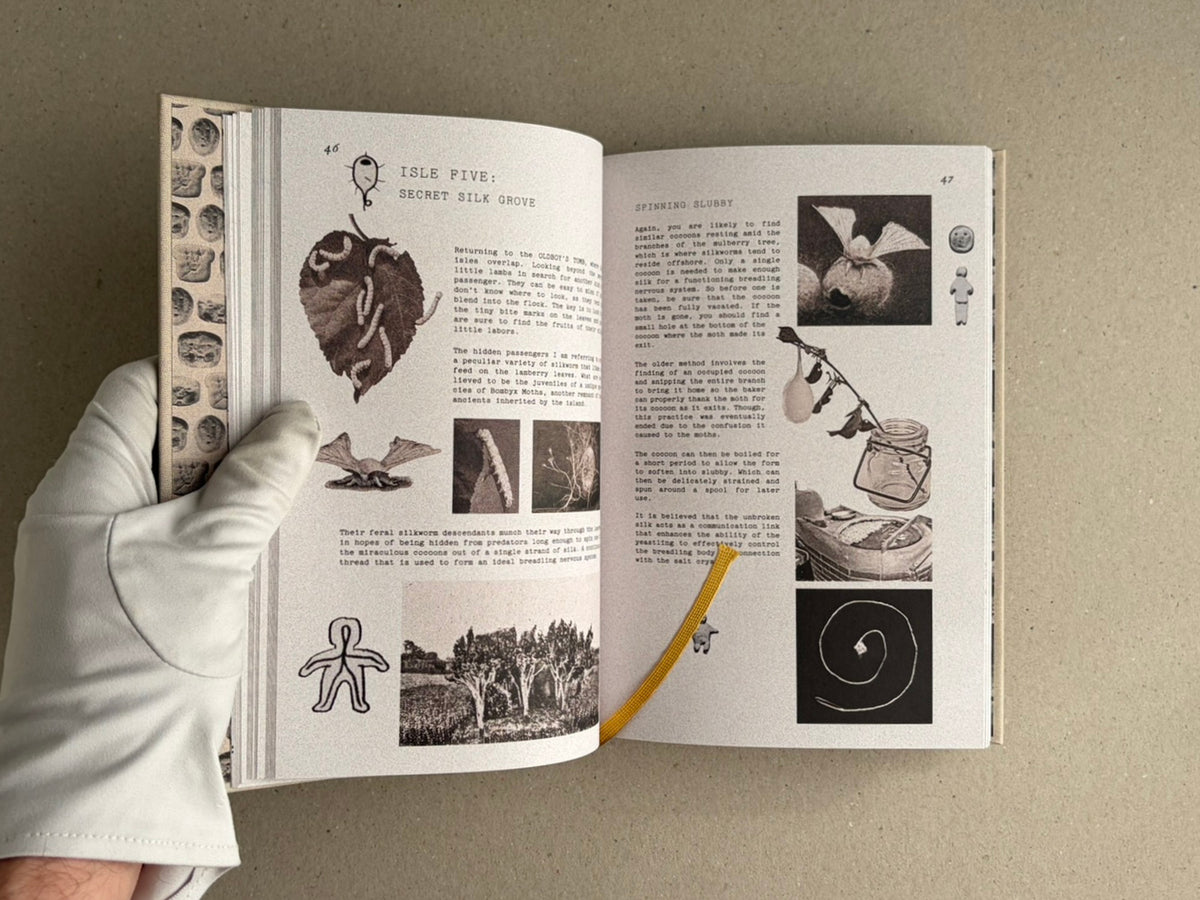Open spread of How to Bake a Breadling by Brad Hock, showing pages 46–47 with collage-style text and images, held open by a gloved hand.