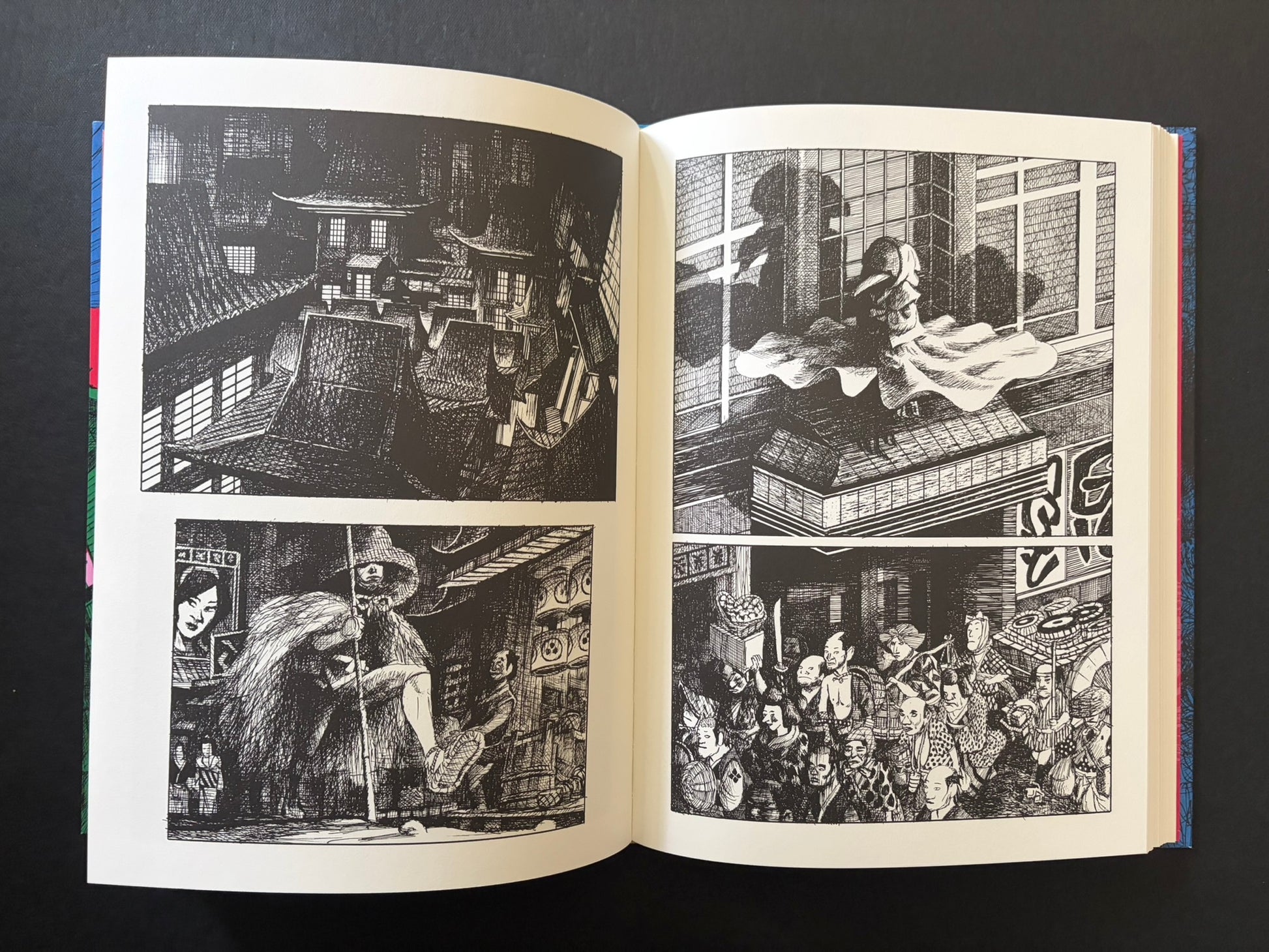 Open GariGari spread with architectural views, a seated figure in foliage, and a crowded scene in the lower right.
