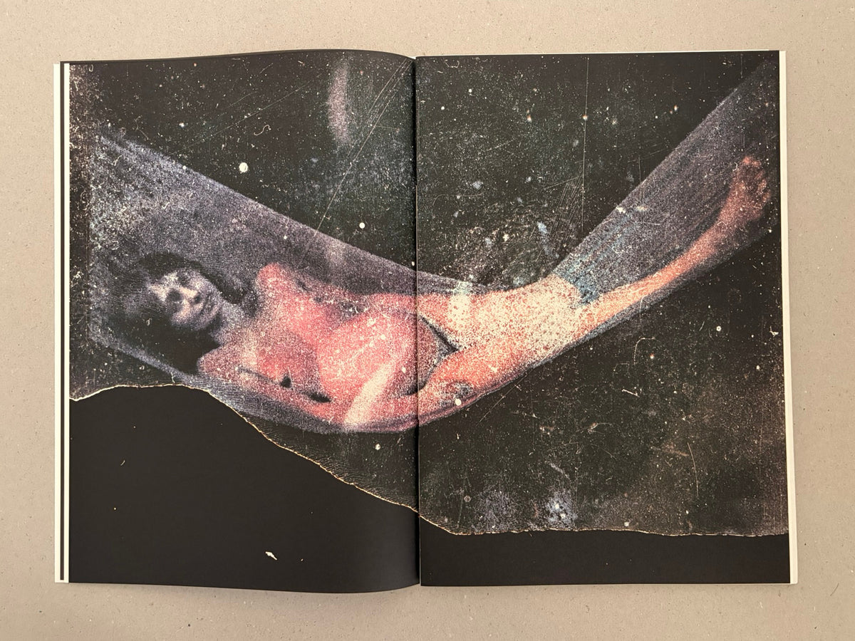 Open spread from Hunger: Epilogue by Michael Ackerman, showing a dark, grainy image of a reclining figure across the gutter.
