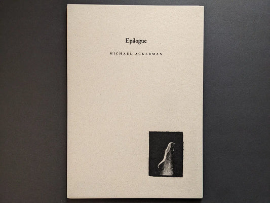 Hunger – Epilogue photobook cover by Michael Ackerman, grey cardboard with black title and a small black-and-white image of a ghostly figure.