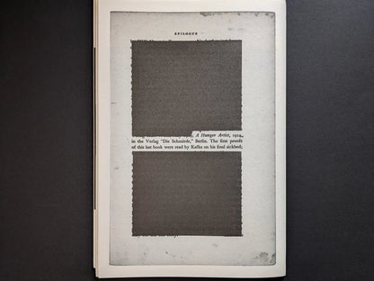 Epilogue page from Hunger – Epilogue showing a framed text layout with two large dark redacted rectangles over Kafka-related text.