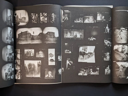 Fold-out interior from Hunger – Epilogue showing a dense contact-sheet style collage of small black-and-white images of people, buildings and streets.