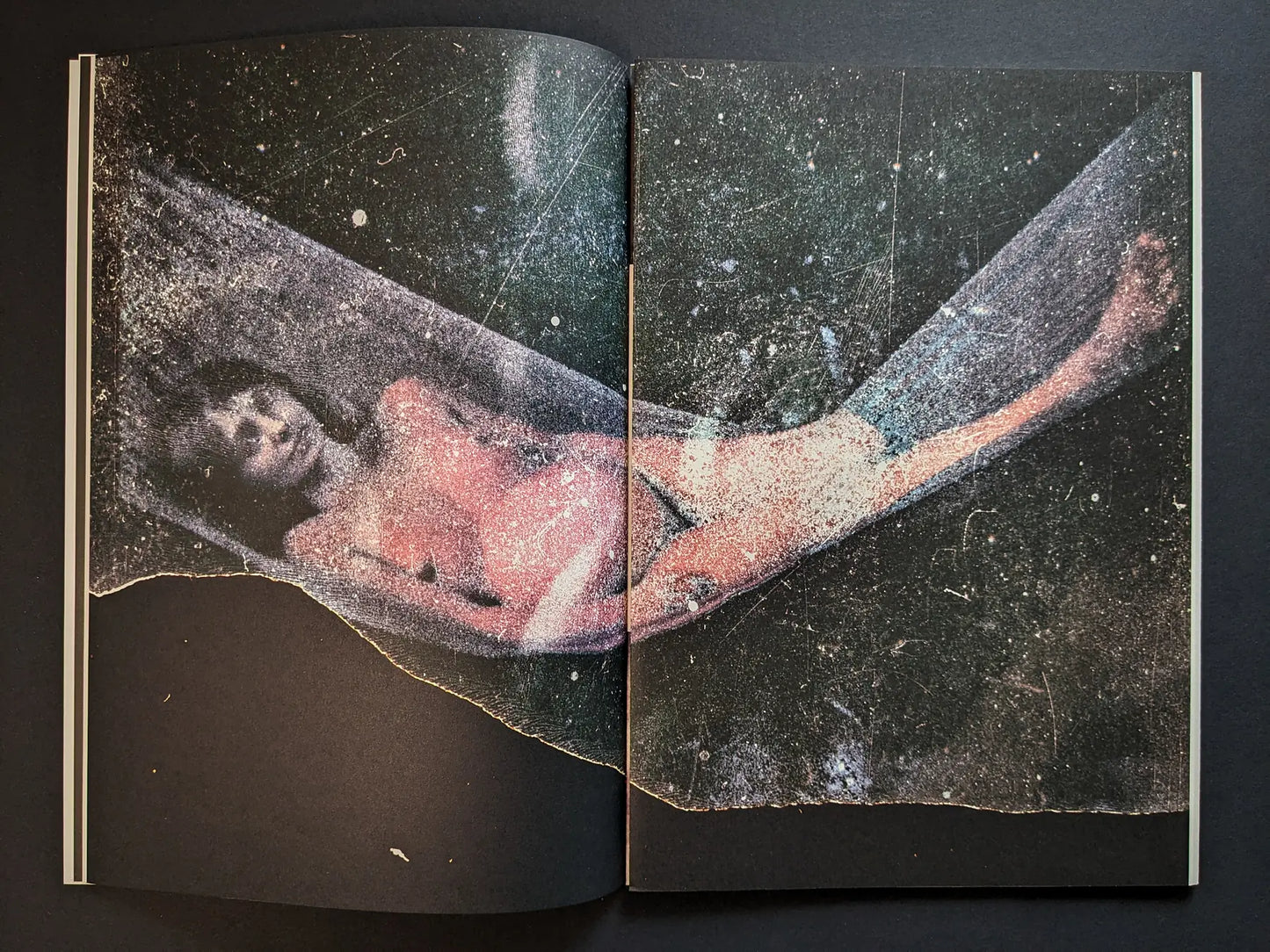 Interior spread from Hunger – Epilogue with a distressed color photograph of a woman lying in a hammock-like shape against a dark starry background.