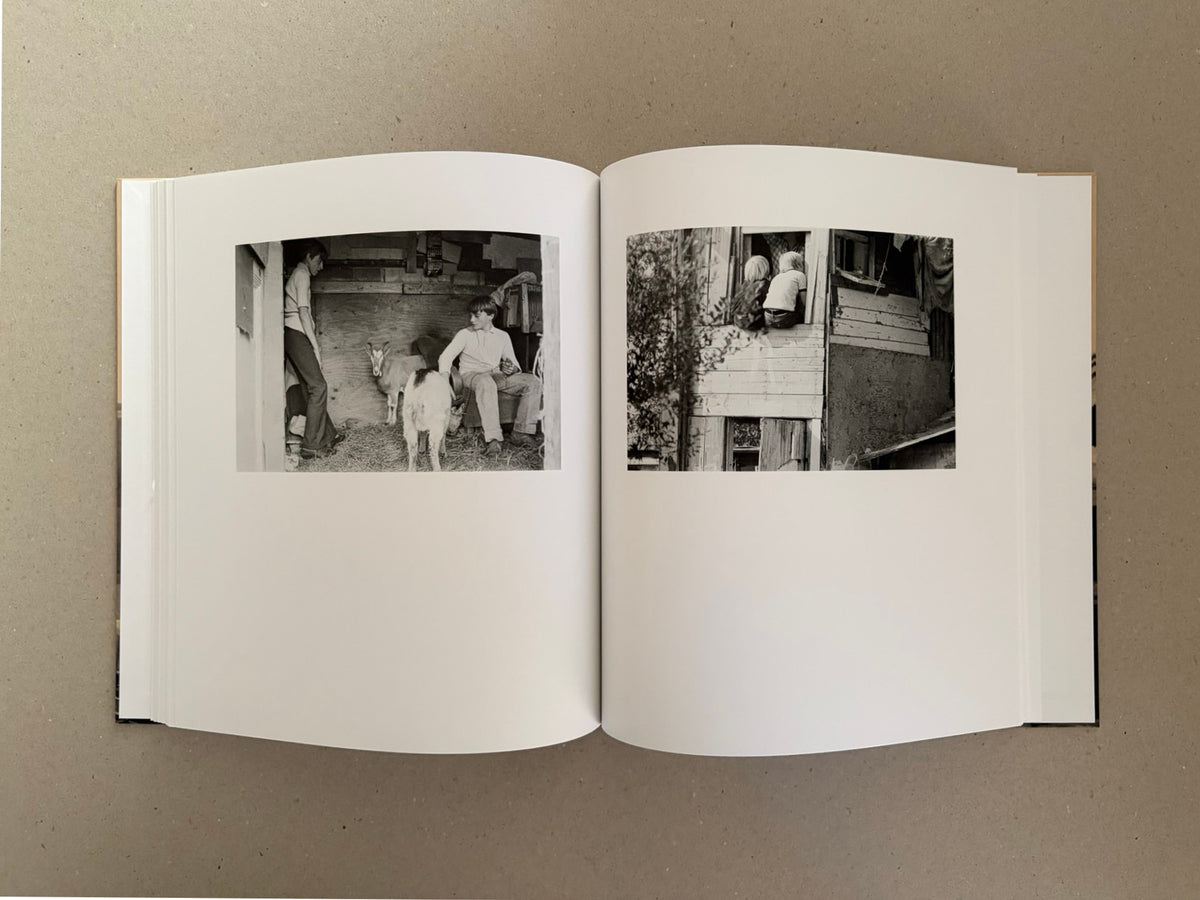 Open spread of Huts, Temples, Castles by Ursula Schulz-Dornburg, showing two black-and-white photographs on facing pages.