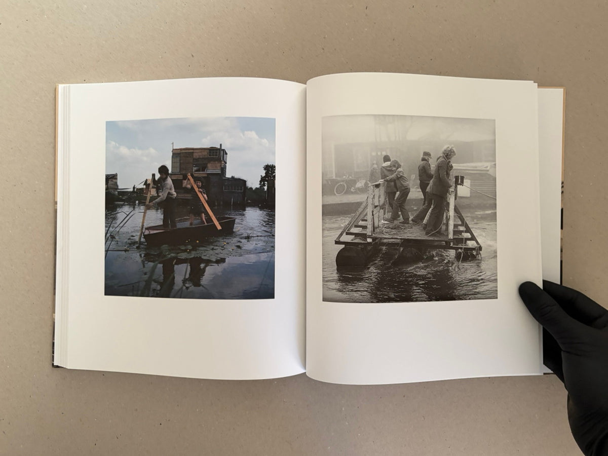 Open spread of Huts, Temples, Castles – Ursula Schulz-Dornburg (Signed Edition), showing two interior photographs of people on makeshift structures in water, one in colour and one in black and white.