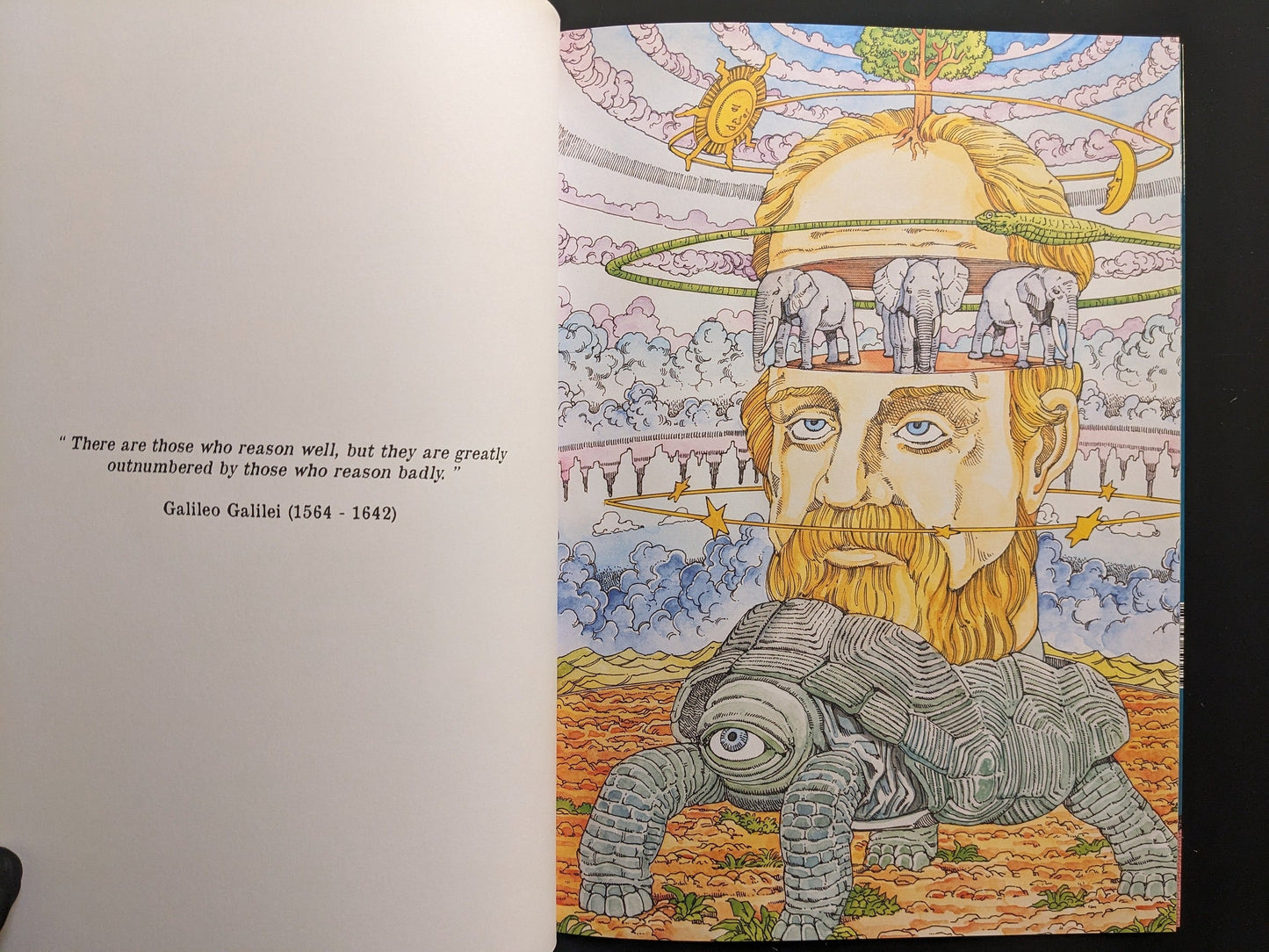 Interior spread with Galileo Galilei, celestial rings, and a turtle device opposite a quotation.