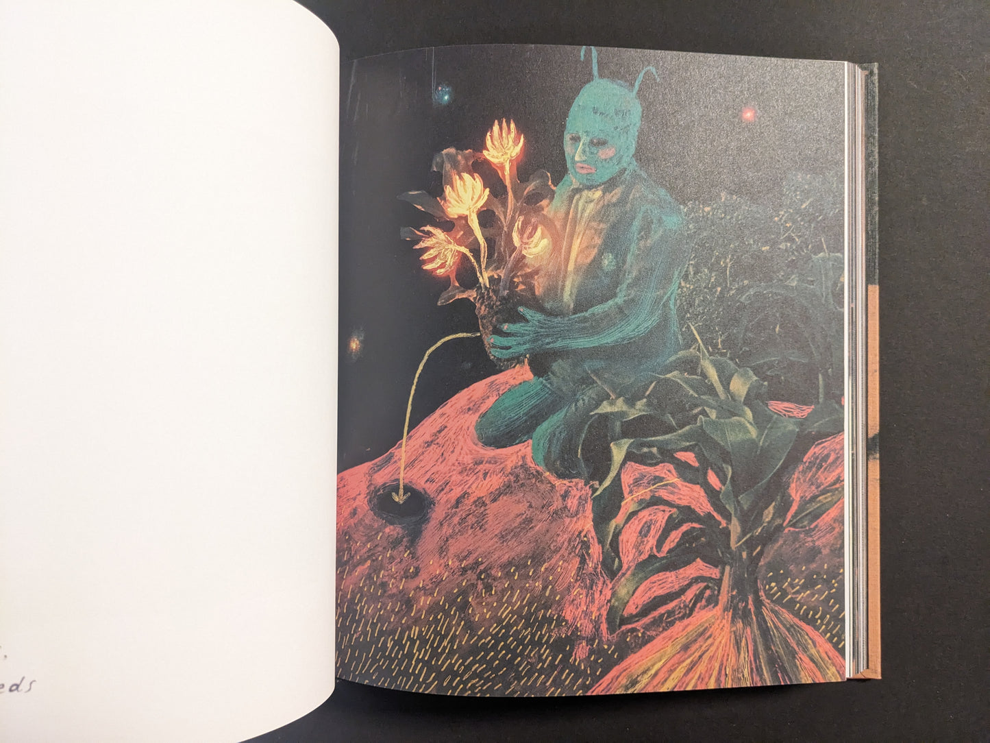 Interior artwork from In a Dark Time, the Eye Begins to See by Julia Soboleva, showing a kneeling blue figure holding glowing flowers with roots.