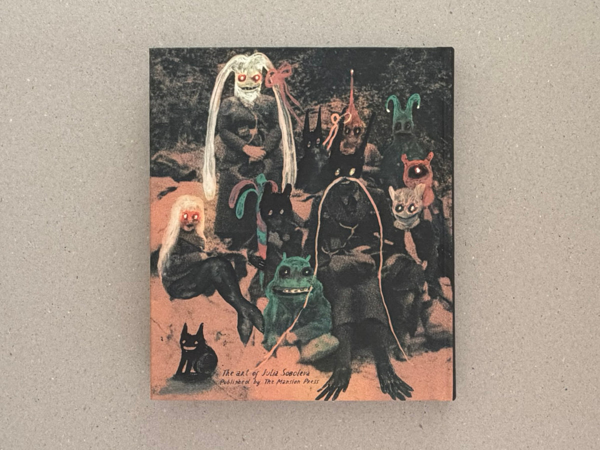 Cover of In a Dark Time, the Eye Begins to See – The Art of Julia Soboleva, showing a dark mixed-media image with several small figures and handwritten title text near the bottom.