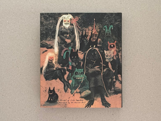 Cover of In a Dark Time, the Eye Begins to See – The Art of Julia Soboleva, showing a dark mixed-media image with several small figures and handwritten title text near the bottom.
