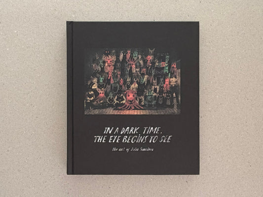 Front cover of In a Dark Time, the Eye Begins to See: The Art of Julia Soboleva, a black hardcover with a small central image and the title printed below.