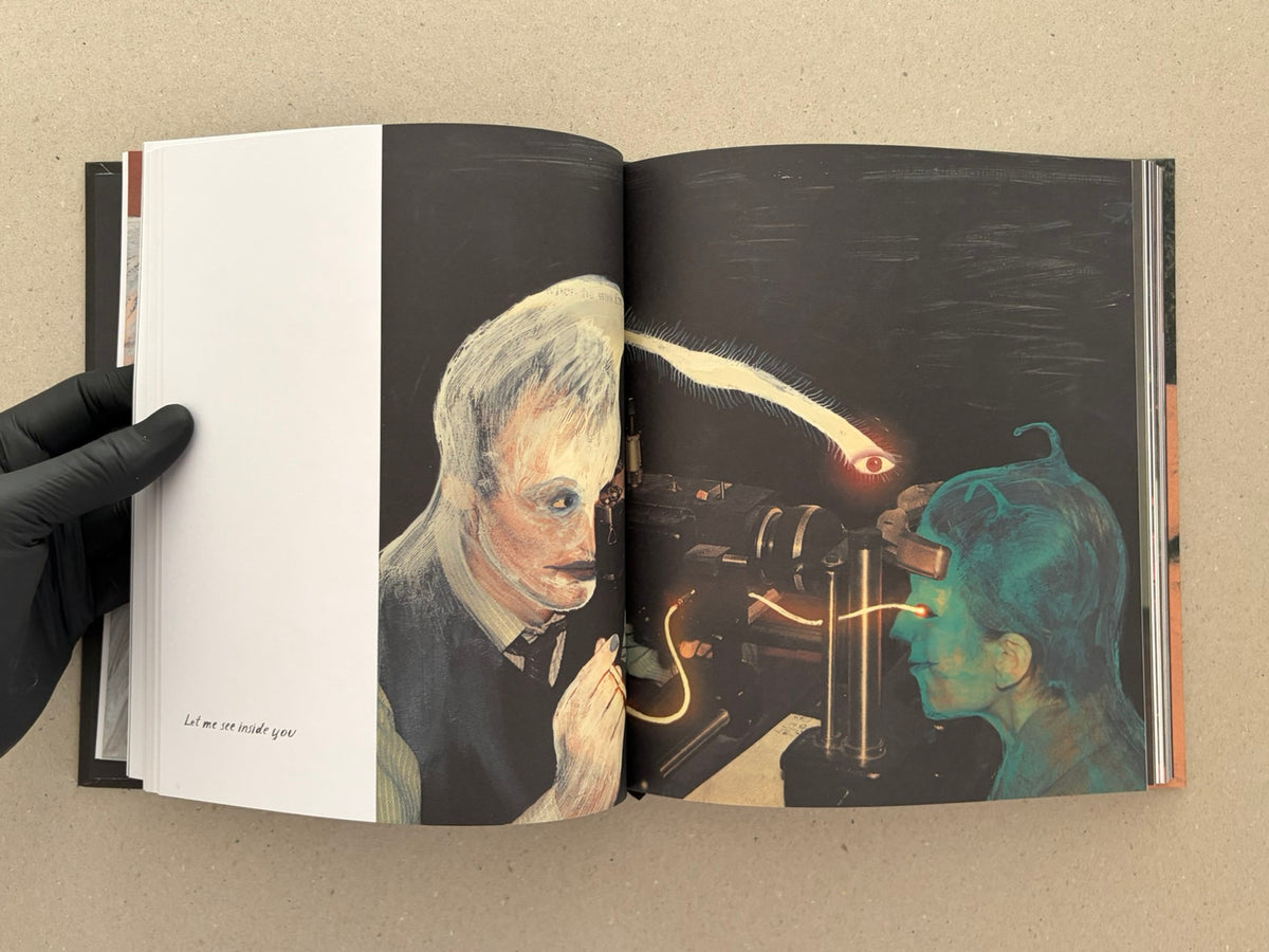 Open spread from In a Dark Time, the Eye Begins to See – The Art of Julia Soboleva, showing a dark mixed-media artwork across the right-hand pages and a white left page with the printed line “Let me see inside you”.
