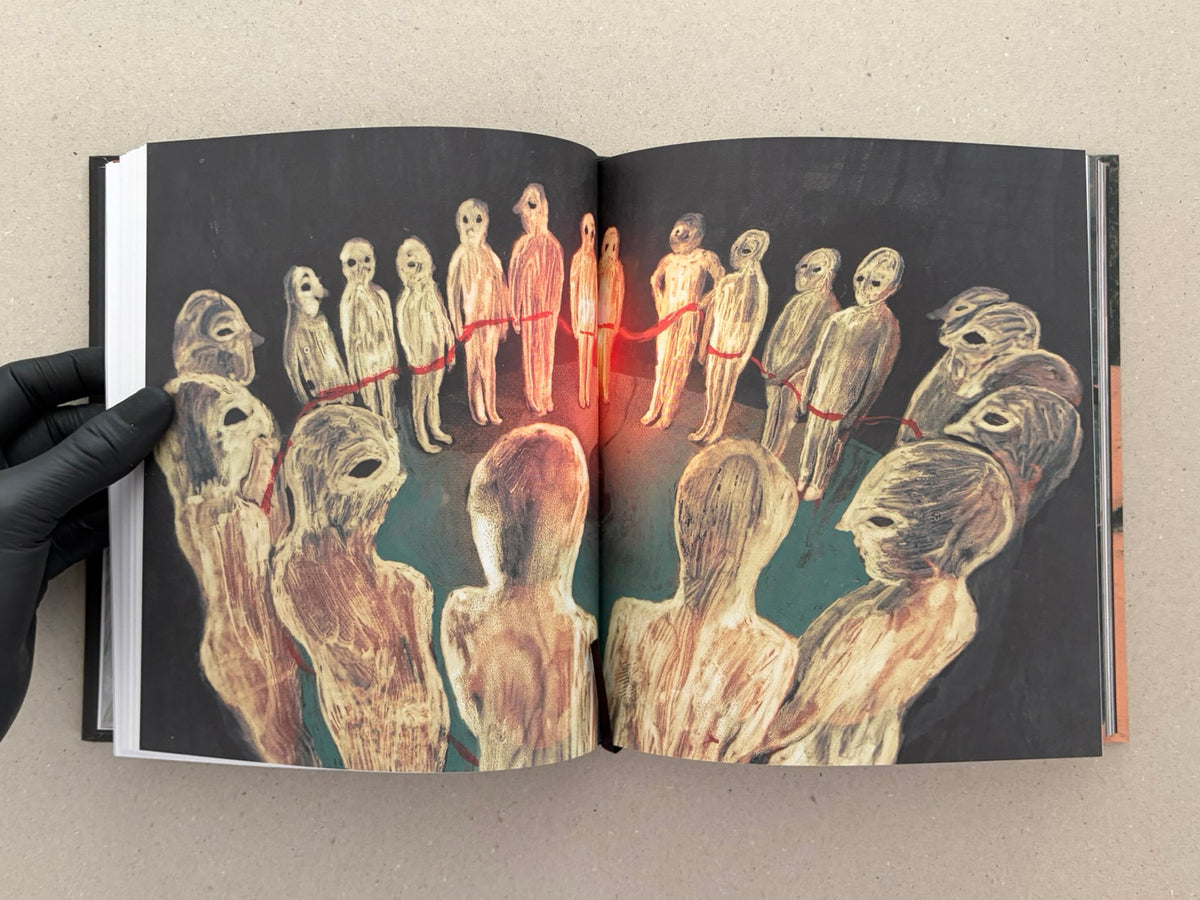 Open artbook spread from In a Dark Time, the Eye Begins to See – The Art of Julia Soboleva, showing a circular arrangement of painted figures on a dark background.