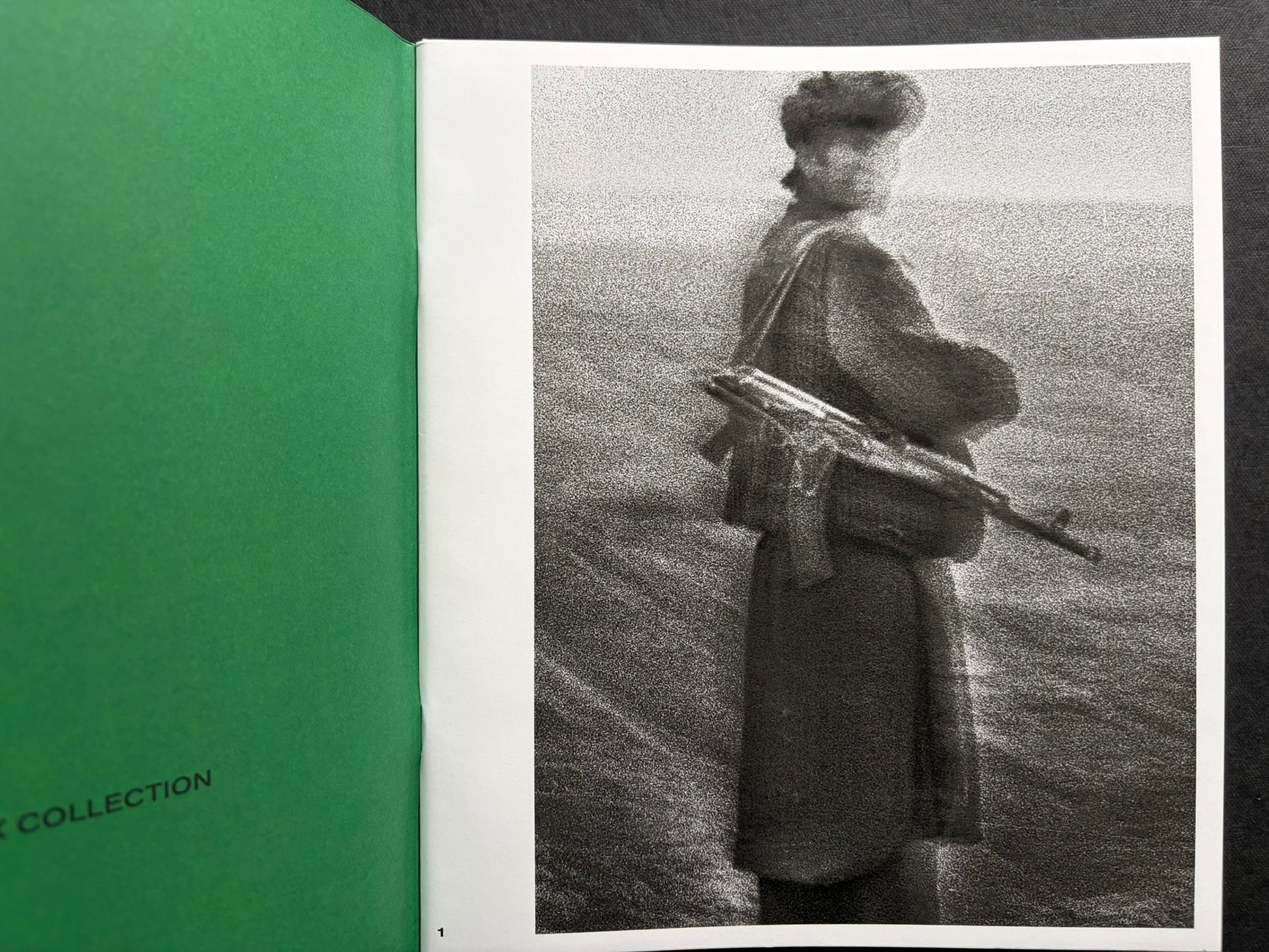 Index by Christopher Anderson, open volume with a black-and-white photograph on the right page and a green endpaper on the left.