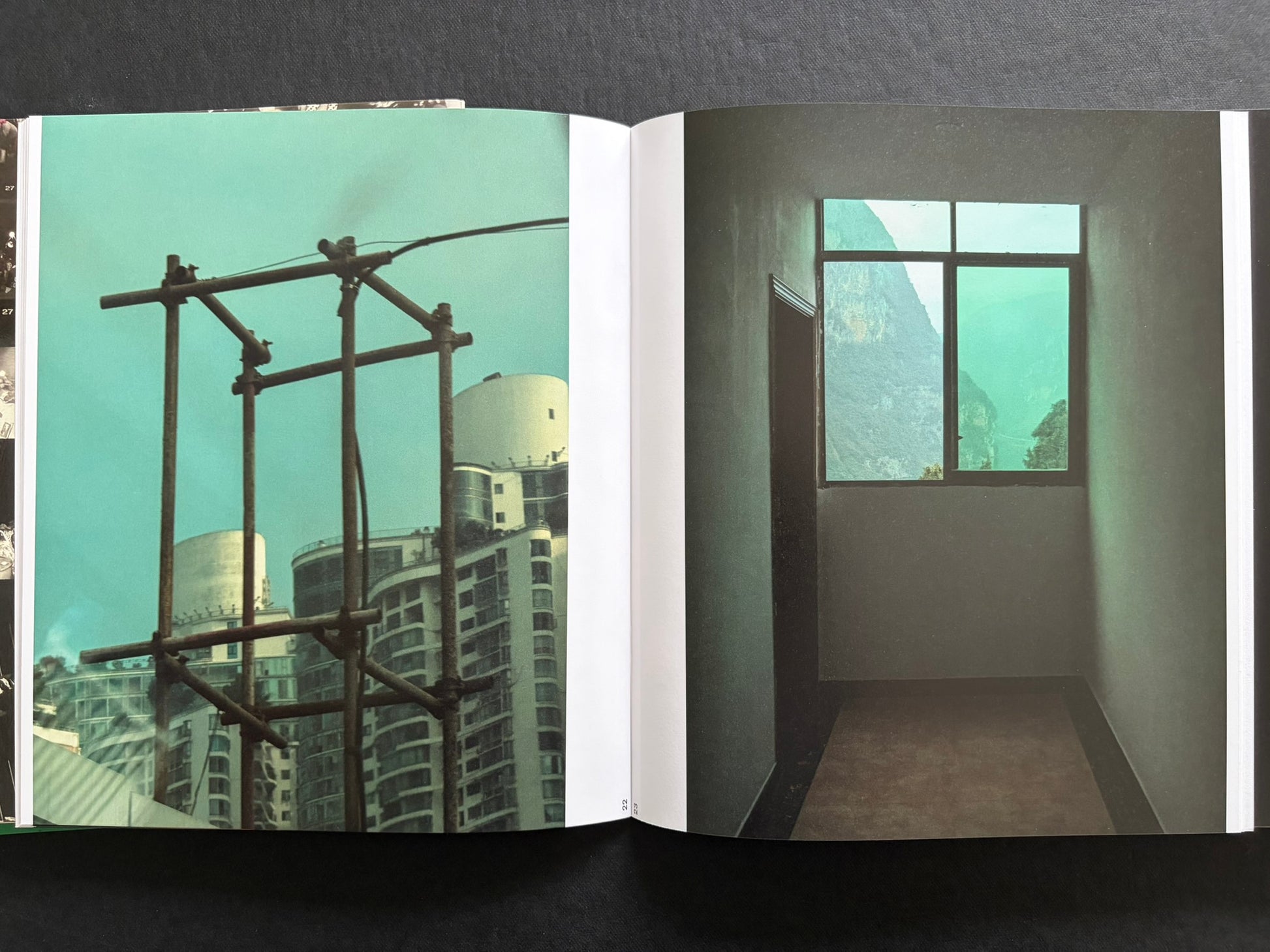Index by Christopher Anderson, spread with a turquoise interior scene on the left and a window view on the right.